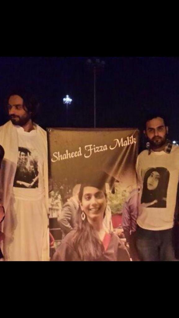 Her brothers with the “Shaheed Fizza Malik” banner at a commemoration